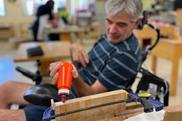 Person using woodworking equipment